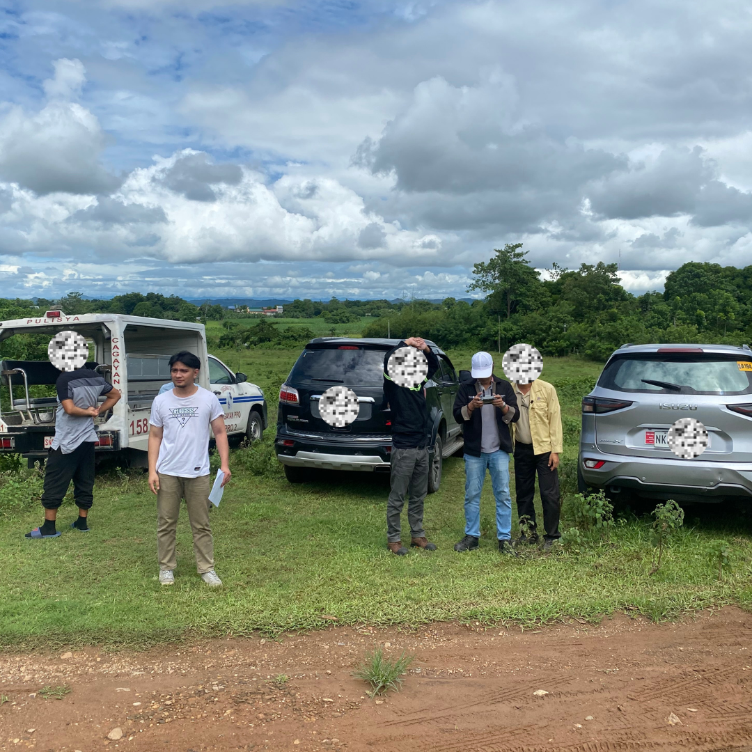 On location for a land survey inspection with the survey team and vehicles