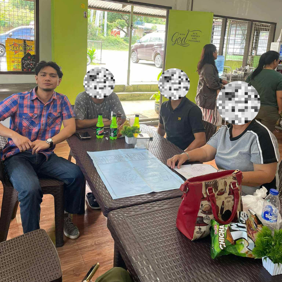 Reviewing a land title plan with a surveying office team
